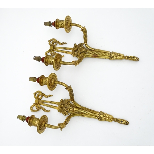 1551 - A pair of 20thC brass two branch wall sconces with bow cresting and fruiting cornucopia detail detai... 