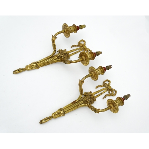 1551 - A pair of 20thC brass two branch wall sconces with bow cresting and fruiting cornucopia detail detai... 