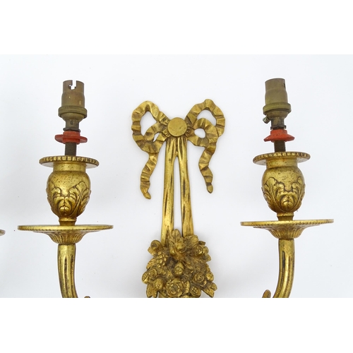 1551 - A pair of 20thC brass two branch wall sconces with bow cresting and fruiting cornucopia detail detai... 