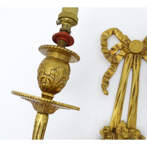 1551 - A pair of 20thC brass two branch wall sconces with bow cresting and fruiting cornucopia detail detai... 