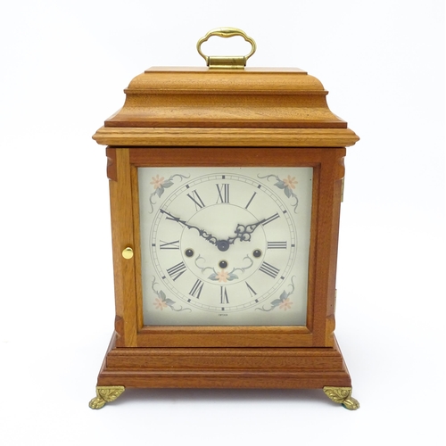 1495 - A 20thC German walnut cased 8 day bracket / mantel clock by Franz Hermle. Approx. 16 3/4