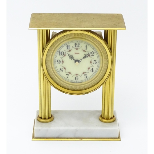 1496 - A 20thC French mantel clock with column style detail and marble base, the dial signed Vedette. Appro... 