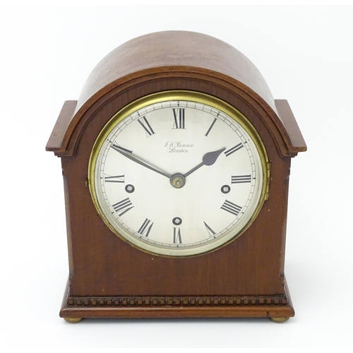 1506 - A mahogany cased mantel clock, the dial with Roman hour marks and signed J. W. Benson, London, the 8... 