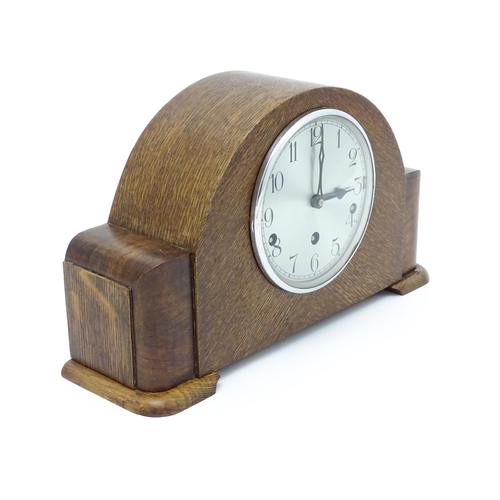 1514 - A mid 20thC oak cased 8 day mantel clock by Garrard. Approx. 9 1/4