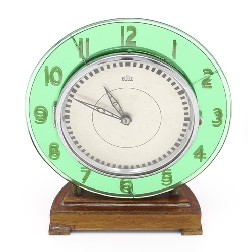 1517 - A Bulle type electric clock on Bakelite style base. Together with a mid century Bulle electric clock... 