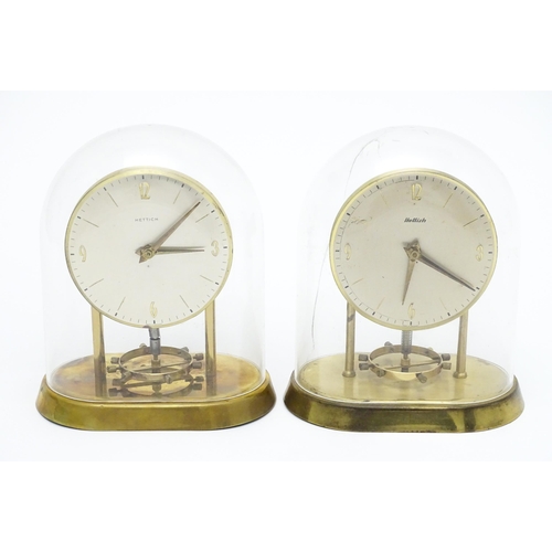 1518 - Two Hettich electric clocks under domes. Approx. 8 3/4