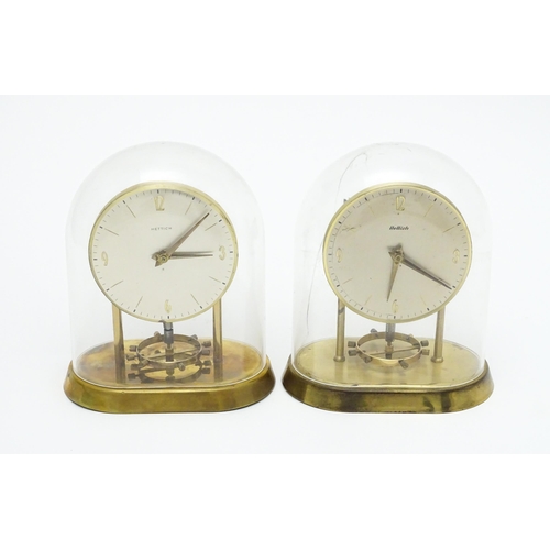 1518 - Two Hettich electric clocks under domes. Approx. 8 3/4