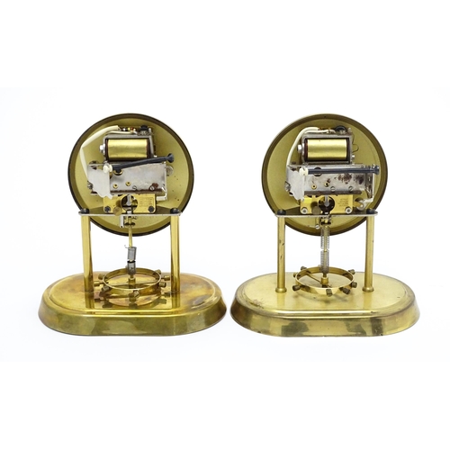 1518 - Two Hettich electric clocks under domes. Approx. 8 3/4