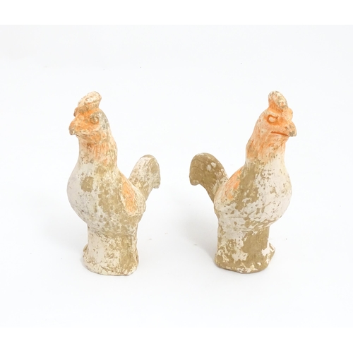 1031 - A pair of Chinese Tang dynasty pottery models of cockerels / roosters. Approx. 6 3/4