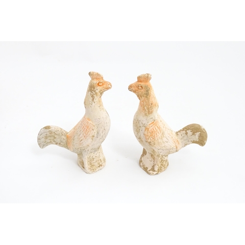 1031 - A pair of Chinese Tang dynasty pottery models of cockerels / roosters. Approx. 6 3/4