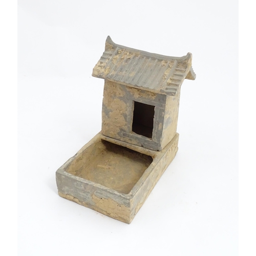 1033 - A Chinese Han dynasty pottery model of a pig sty with hut, a model of a boar and a model of a duck. ... 