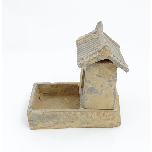 1033 - A Chinese Han dynasty pottery model of a pig sty with hut, a model of a boar and a model of a duck. ... 