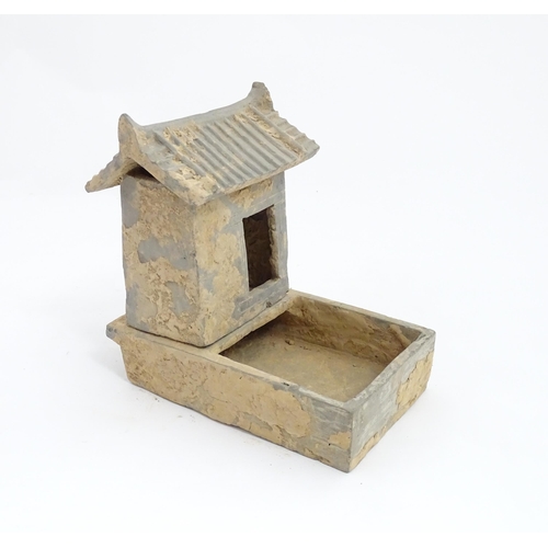 1033 - A Chinese Han dynasty pottery model of a pig sty with hut, a model of a boar and a model of a duck. ... 