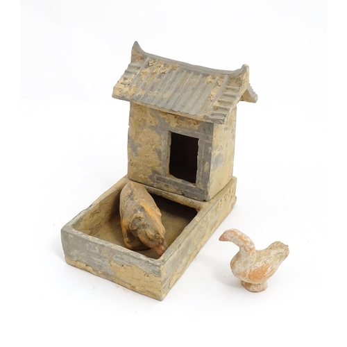 1033 - A Chinese Han dynasty pottery model of a pig sty with hut, a model of a boar and a model of a duck. ... 