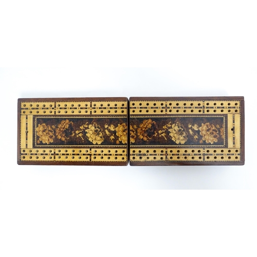 1064 - A 19thC Tunbridge ware travelling / folding cribbage board with floral and foliate decoration. Toget... 