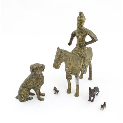 1077 - Four Victorian and later models of dogs to include a cast brass Setter, a carved wooden charm modell... 