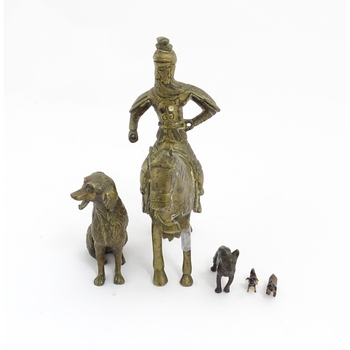 1077 - Four Victorian and later models of dogs to include a cast brass Setter, a carved wooden charm modell... 