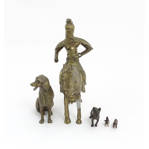 1077 - Four Victorian and later models of dogs to include a cast brass Setter, a carved wooden charm modell... 