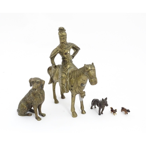 1077 - Four Victorian and later models of dogs to include a cast brass Setter, a carved wooden charm modell... 