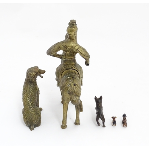 1077 - Four Victorian and later models of dogs to include a cast brass Setter, a carved wooden charm modell... 