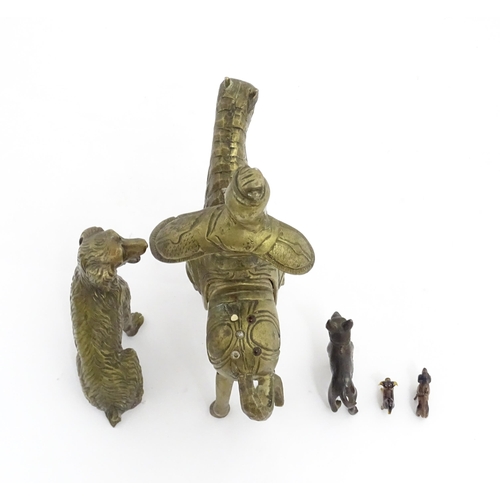 1077 - Four Victorian and later models of dogs to include a cast brass Setter, a carved wooden charm modell... 