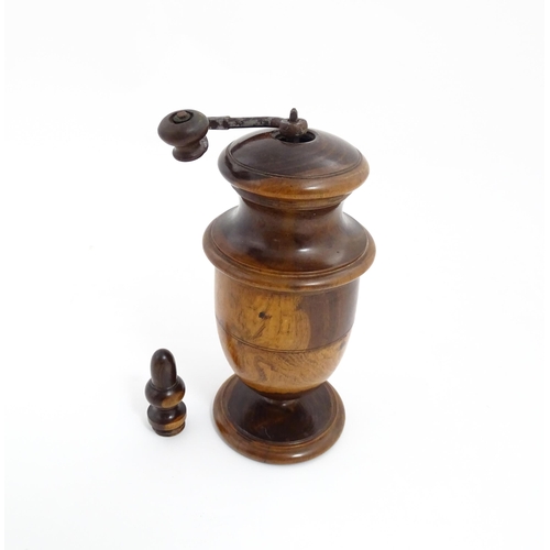 1123 - Treen : An 18thC lignum vitae spice / coffee grinder of urn form, the iron spigot concealed by an ac... 