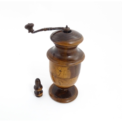 1123 - Treen : An 18thC lignum vitae spice / coffee grinder of urn form, the iron spigot concealed by an ac... 