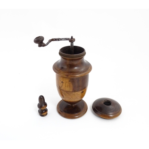 1123 - Treen : An 18thC lignum vitae spice / coffee grinder of urn form, the iron spigot concealed by an ac... 