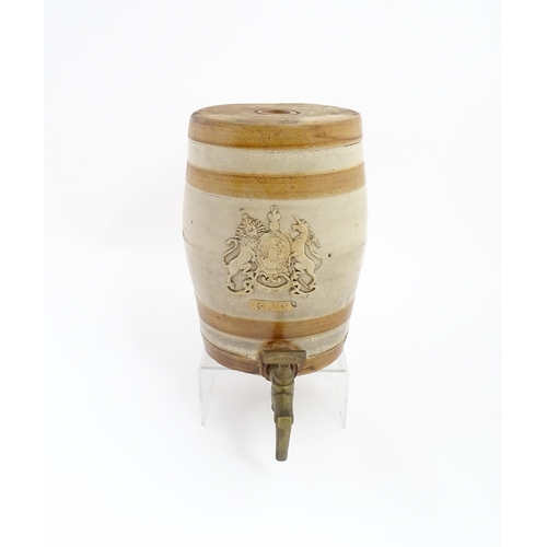 1312 - A 19thC stoneware Gin barrel bearing the coat of arms of the United Kingdom and labelled Gin under. ... 