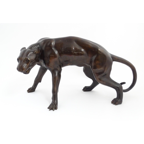 1333 - A 20thC cast bronze sculpture modelled as a panther / big cat. Approx. 13