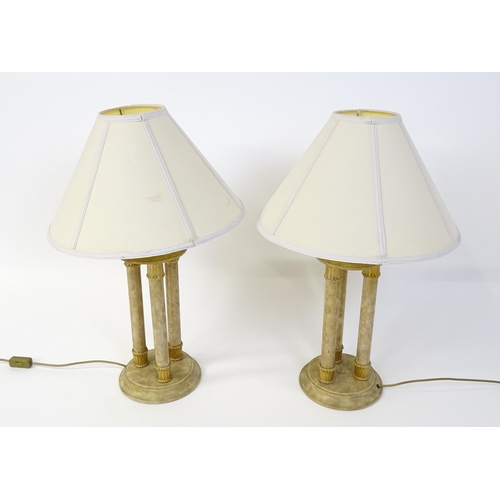 1537 - A pair of table lamps with three column detail. Approx. 31