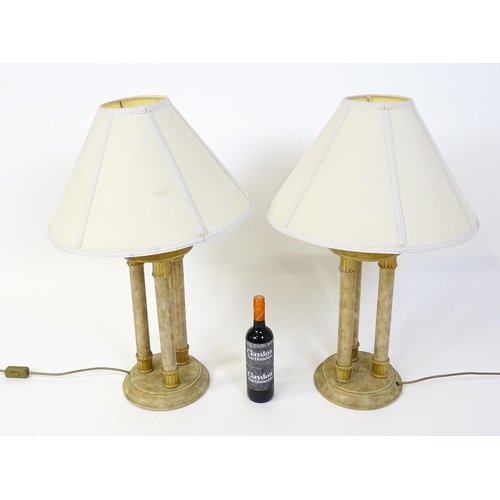 1537 - A pair of table lamps with three column detail. Approx. 31