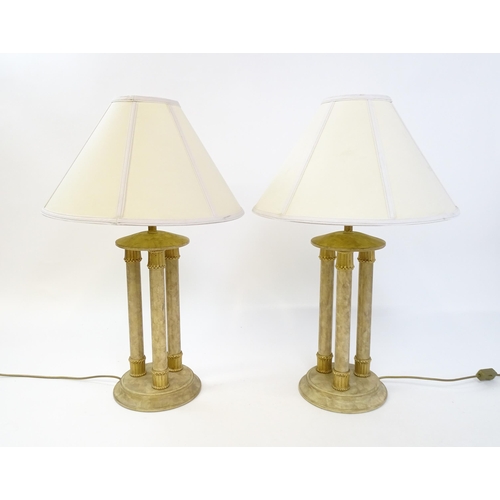 1537 - A pair of table lamps with three column detail. Approx. 31