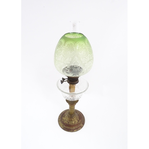 1538 - A Victorian oil lamp with cut glass reservoir and green etched glass shade. Approx. 24