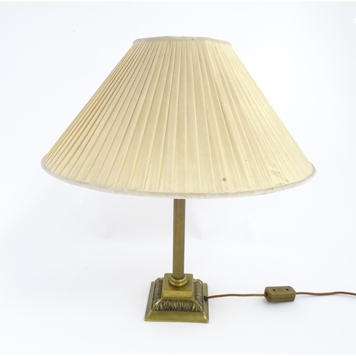 1546 - A mid to late 20thC brass table lamp with of Corinthian column form. Approx. 22 1/2