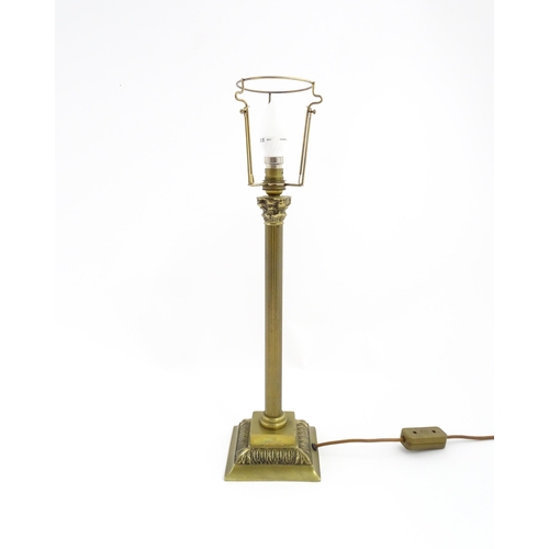 1546 - A mid to late 20thC brass table lamp with of Corinthian column form. Approx. 22 1/2