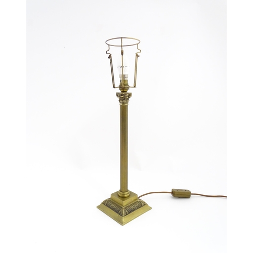 1546 - A mid to late 20thC brass table lamp with of Corinthian column form. Approx. 22 1/2