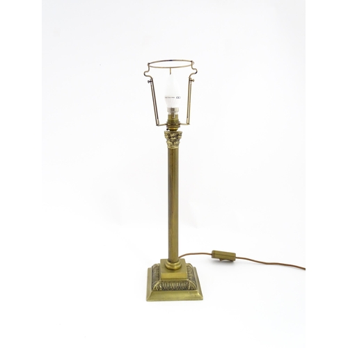 1546 - A mid to late 20thC brass table lamp with of Corinthian column form. Approx. 22 1/2