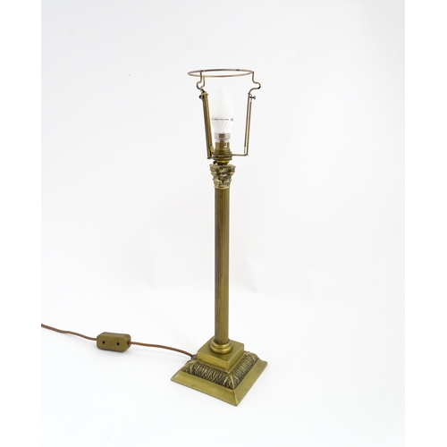 1546 - A mid to late 20thC brass table lamp with of Corinthian column form. Approx. 22 1/2