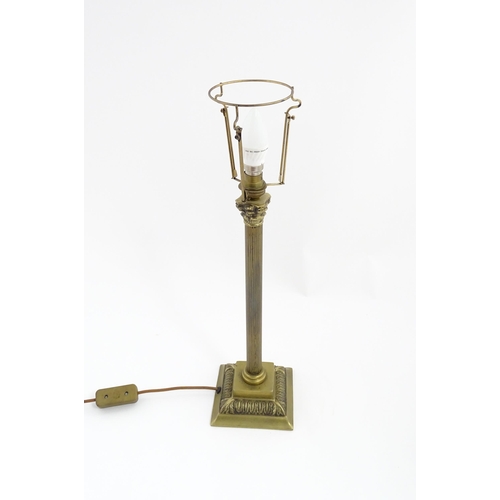 1546 - A mid to late 20thC brass table lamp with of Corinthian column form. Approx. 22 1/2