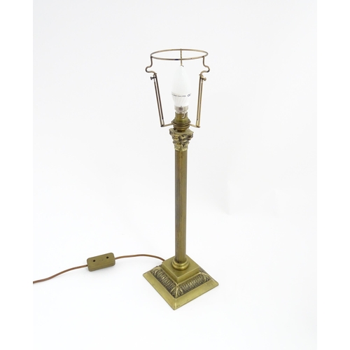 1546 - A mid to late 20thC brass table lamp with of Corinthian column form. Approx. 22 1/2