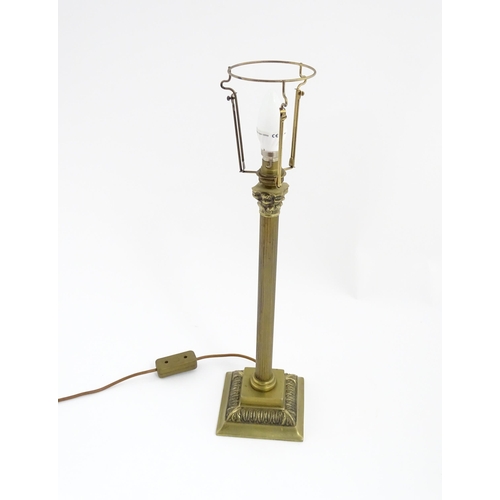 1546 - A mid to late 20thC brass table lamp with of Corinthian column form. Approx. 22 1/2