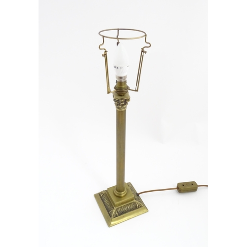 1546 - A mid to late 20thC brass table lamp with of Corinthian column form. Approx. 22 1/2