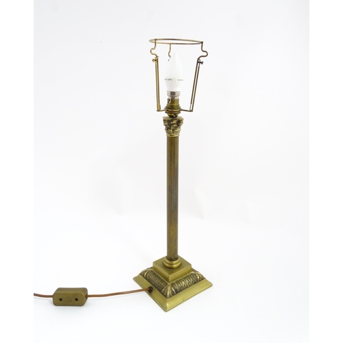 1546 - A mid to late 20thC brass table lamp with of Corinthian column form. Approx. 22 1/2