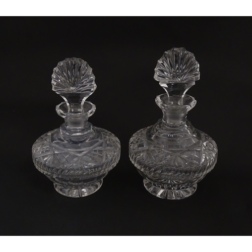 158 - Two cut glass scent / perfume bottles. Approx. 8 1/2