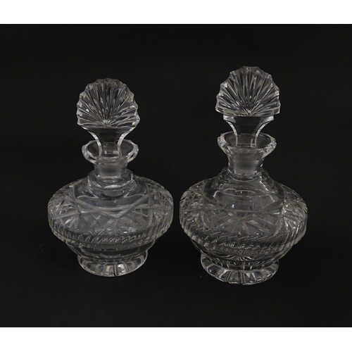 158 - Two cut glass scent / perfume bottles. Approx. 8 1/2