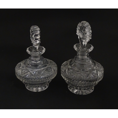 158 - Two cut glass scent / perfume bottles. Approx. 8 1/2