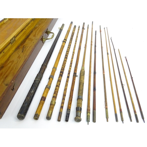 1305 - Fishing: a late 19thC fishing rod box , containing a quantity of split cane, bamboo and greenheart r... 