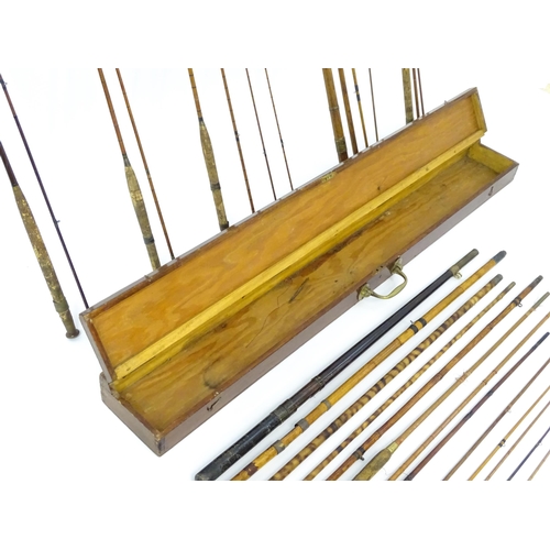 1305 - Fishing: a late 19thC fishing rod box , containing a quantity of split cane, bamboo and greenheart r... 