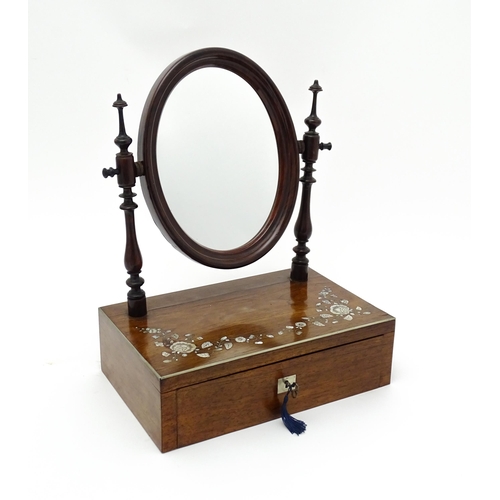 1736 - A 20thC rosewood dressing mirror with two turned upright supports above an inlaid top and having a s... 